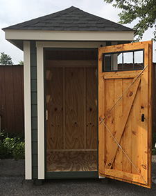 garden shed with beautiful wood door open
